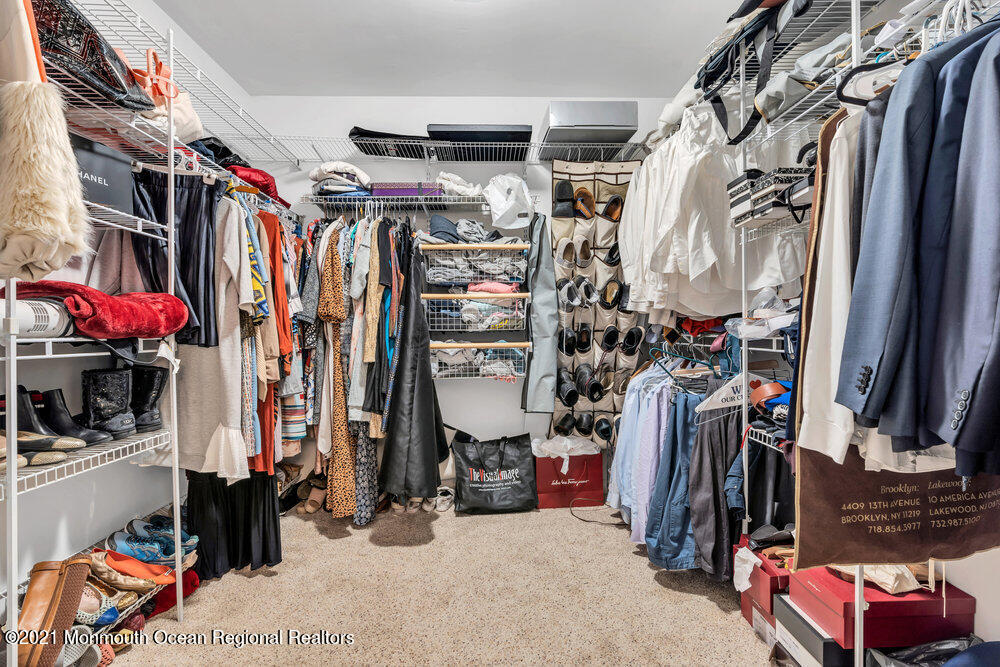 67 Chelsea Road Jackson, NJ 08527 - Photo 41 of 53 a view of walk in closet with clothes and shoes