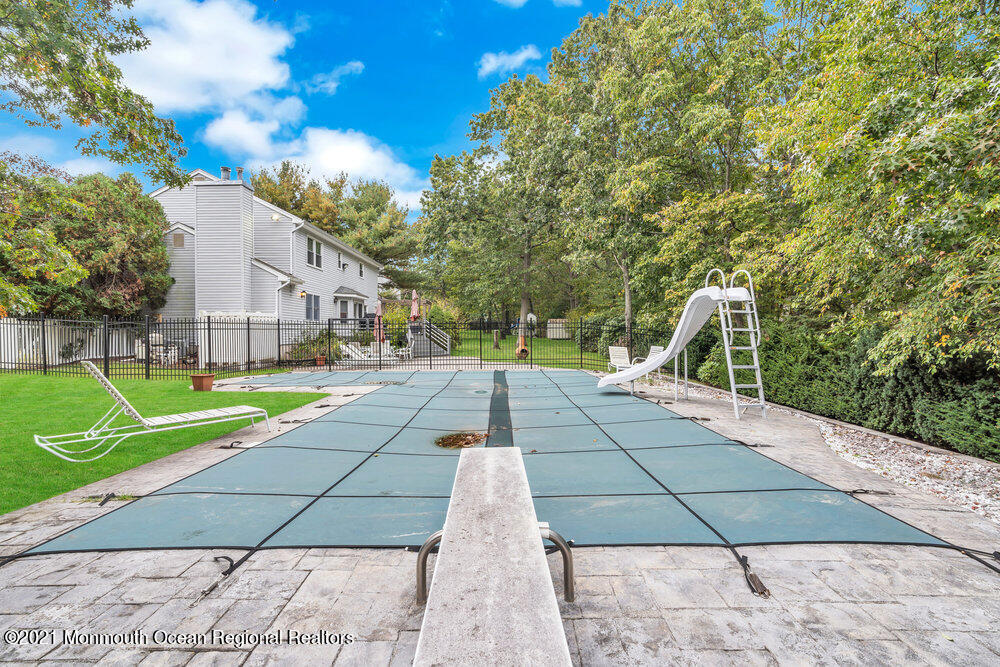 67 Chelsea Road Jackson, NJ 08527 - Photo 46 of 53 a view of backyard with swimming pool and seating space