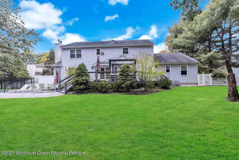 67 Chelsea Road Jackson, NJ 08527 - Photo 51 of 53 a front view of a house with garden