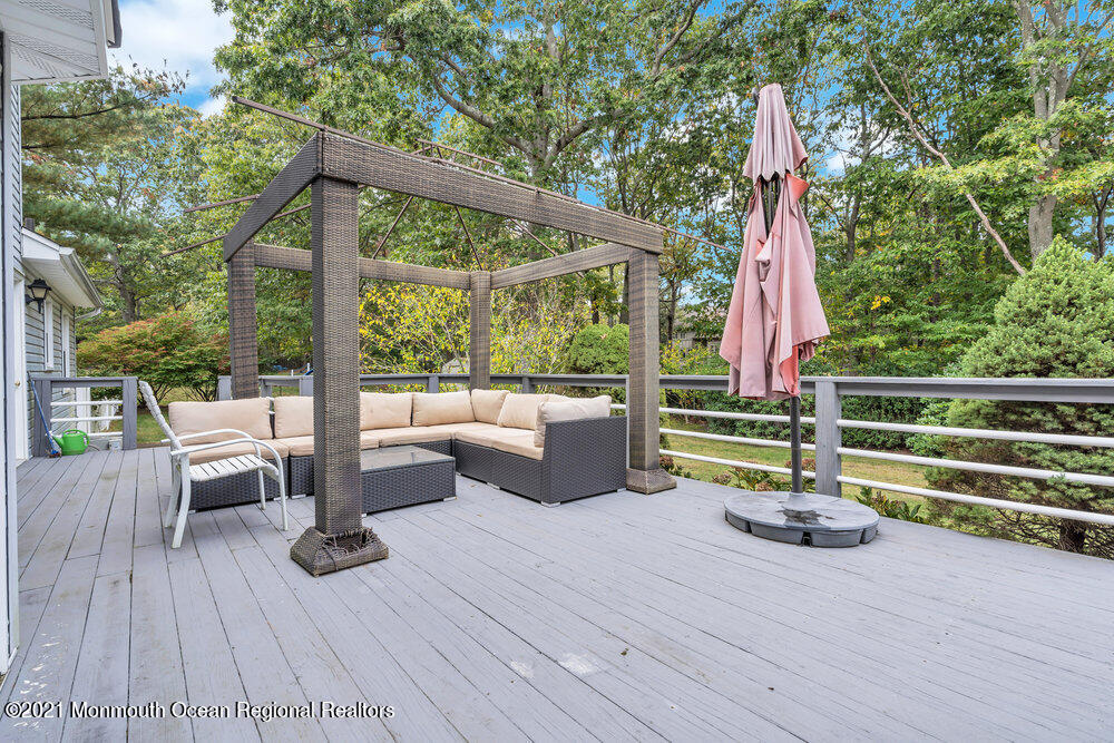 67 Chelsea Road Jackson, NJ 08527 - Photo 52 of 53 a view of a deck with chairs and wooden floor