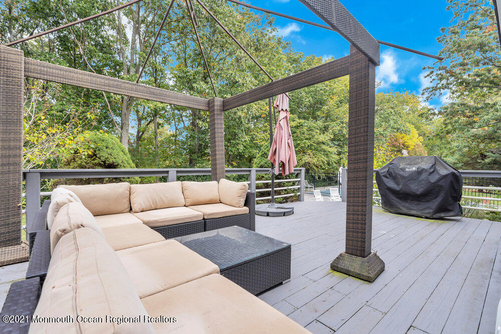 67 Chelsea Road Jackson, NJ 08527 - Photo 53 of 53 a living room with patio furniture and a wooden floor