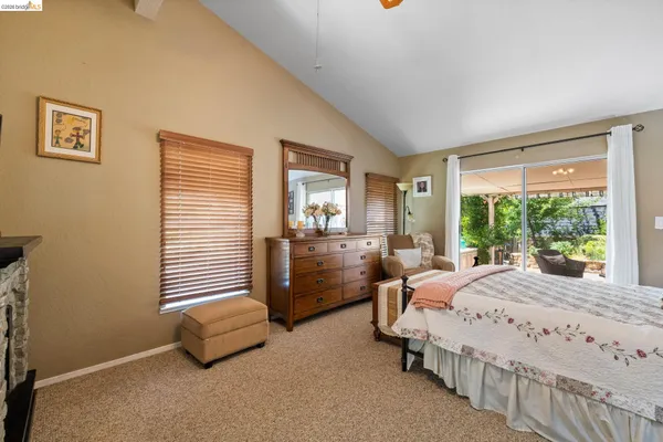 a bedroom with bed and window