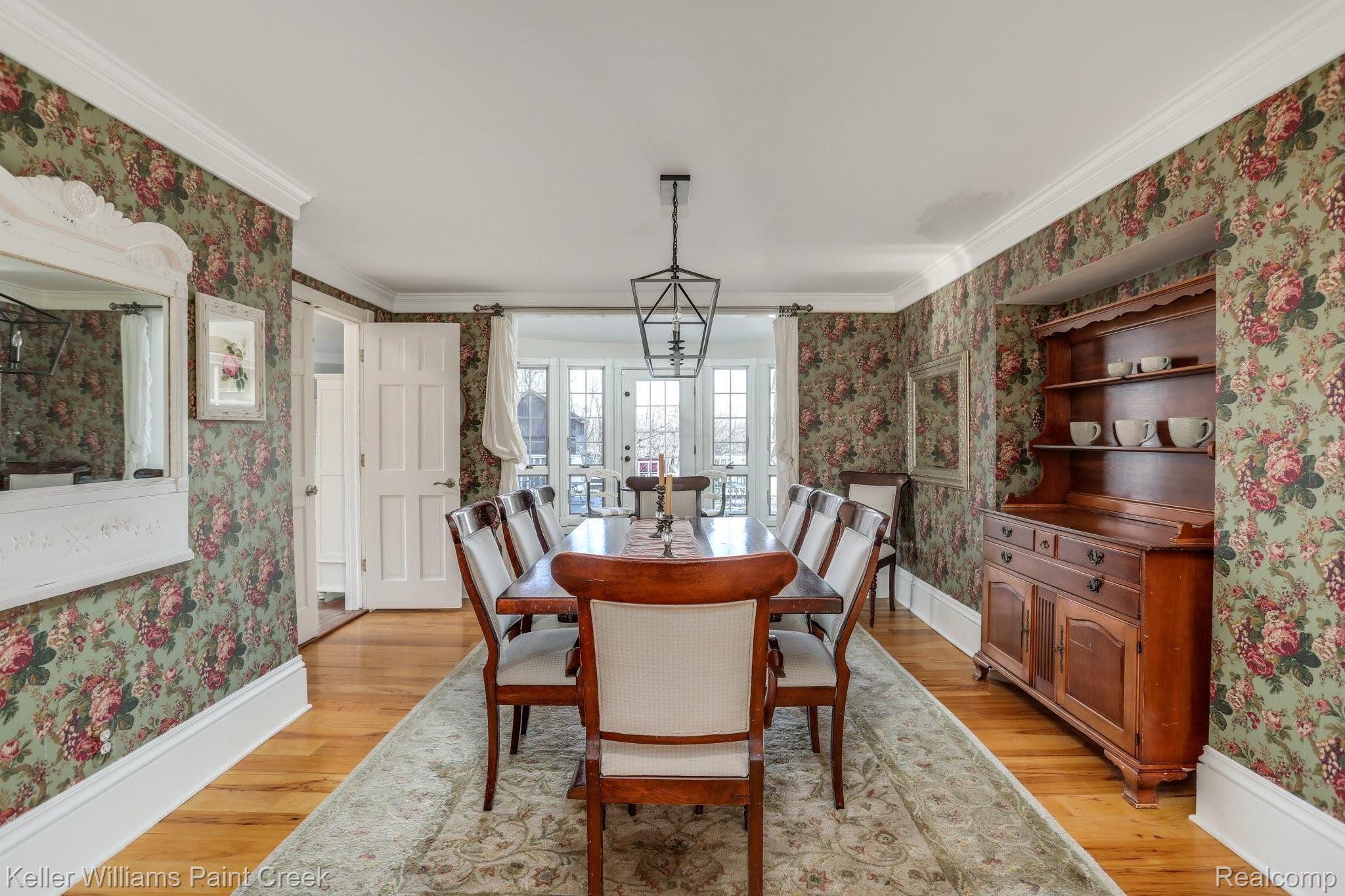115 Michael Road Lapeer, MI 48446 - Photo 16 of 64 Classic Sage Green Floral Wallpaper in the Formal Dining Room adds subtle visual interest in the heart of the Home