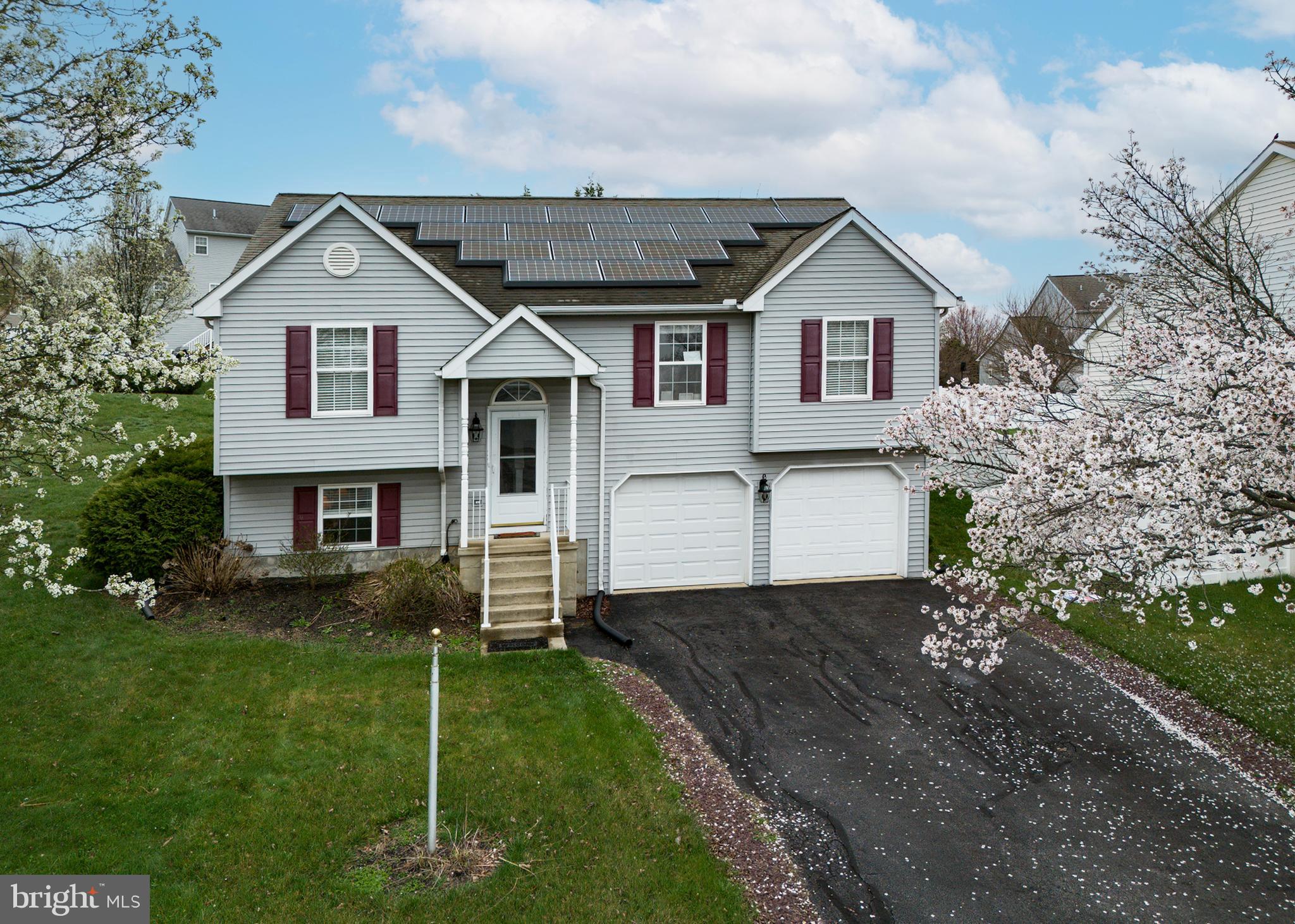 606 Butterfly Circle Dallastown, PA 17313 - Photo 1 of 40 a front view of a house with a yard