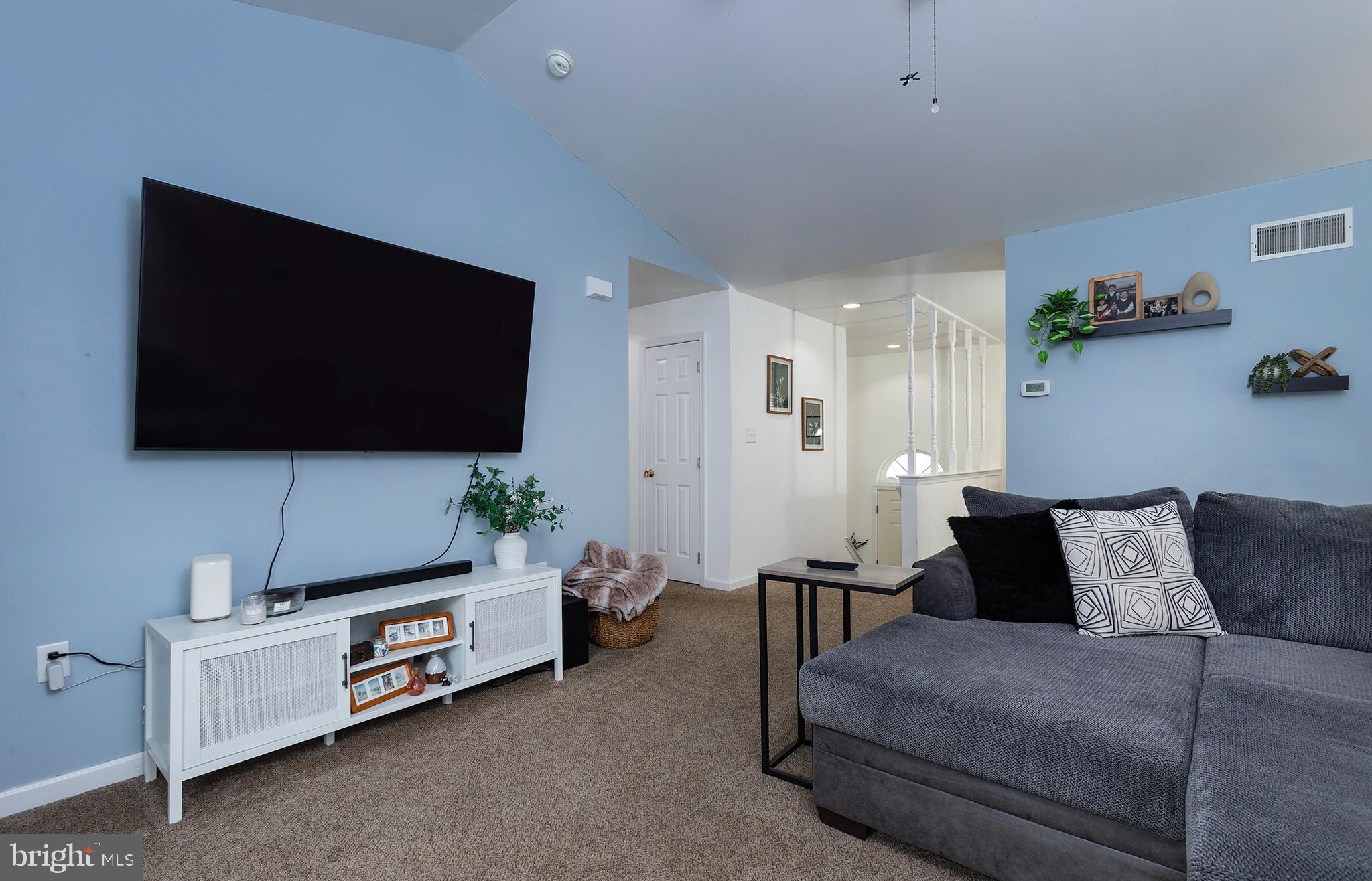 606 Butterfly Circle Dallastown, PA 17313 - Photo 12 of 40 a living room with furniture and a flat screen tv
