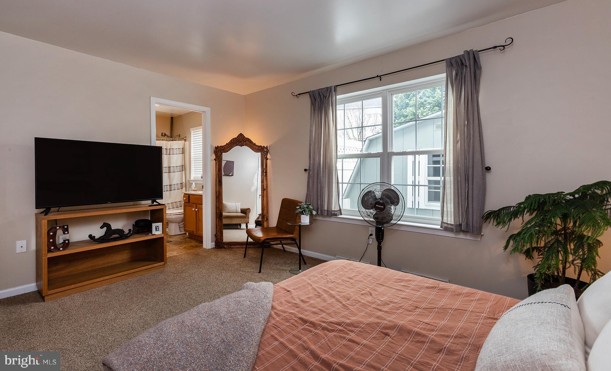 606 Butterfly Circle Dallastown, PA 17313 - Photo 17 of 40 a bedroom with furniture and a flat screen tv