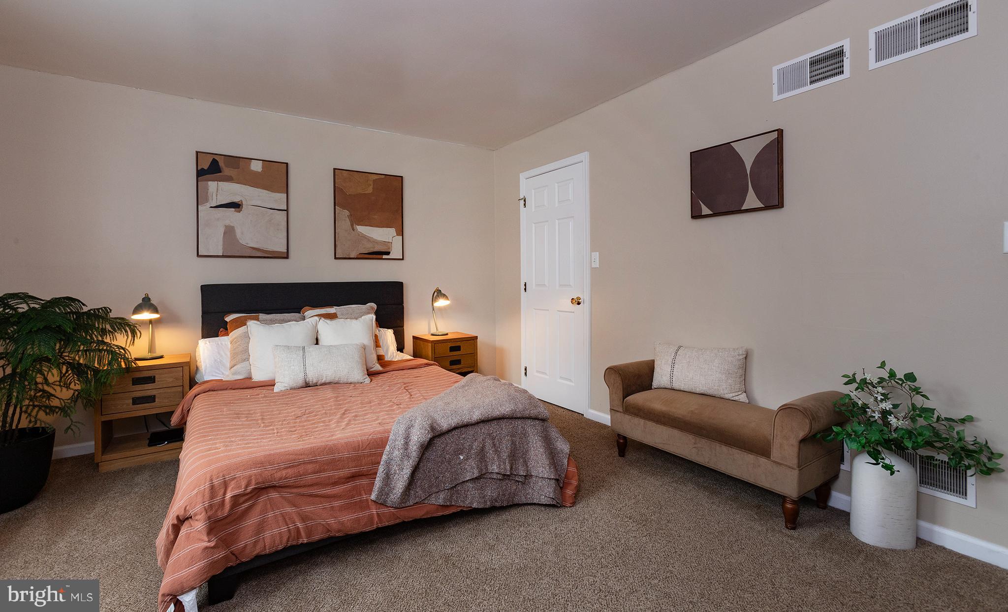 606 Butterfly Circle Dallastown, PA 17313 - Photo 18 of 40 a bedroom with a bed and a couch