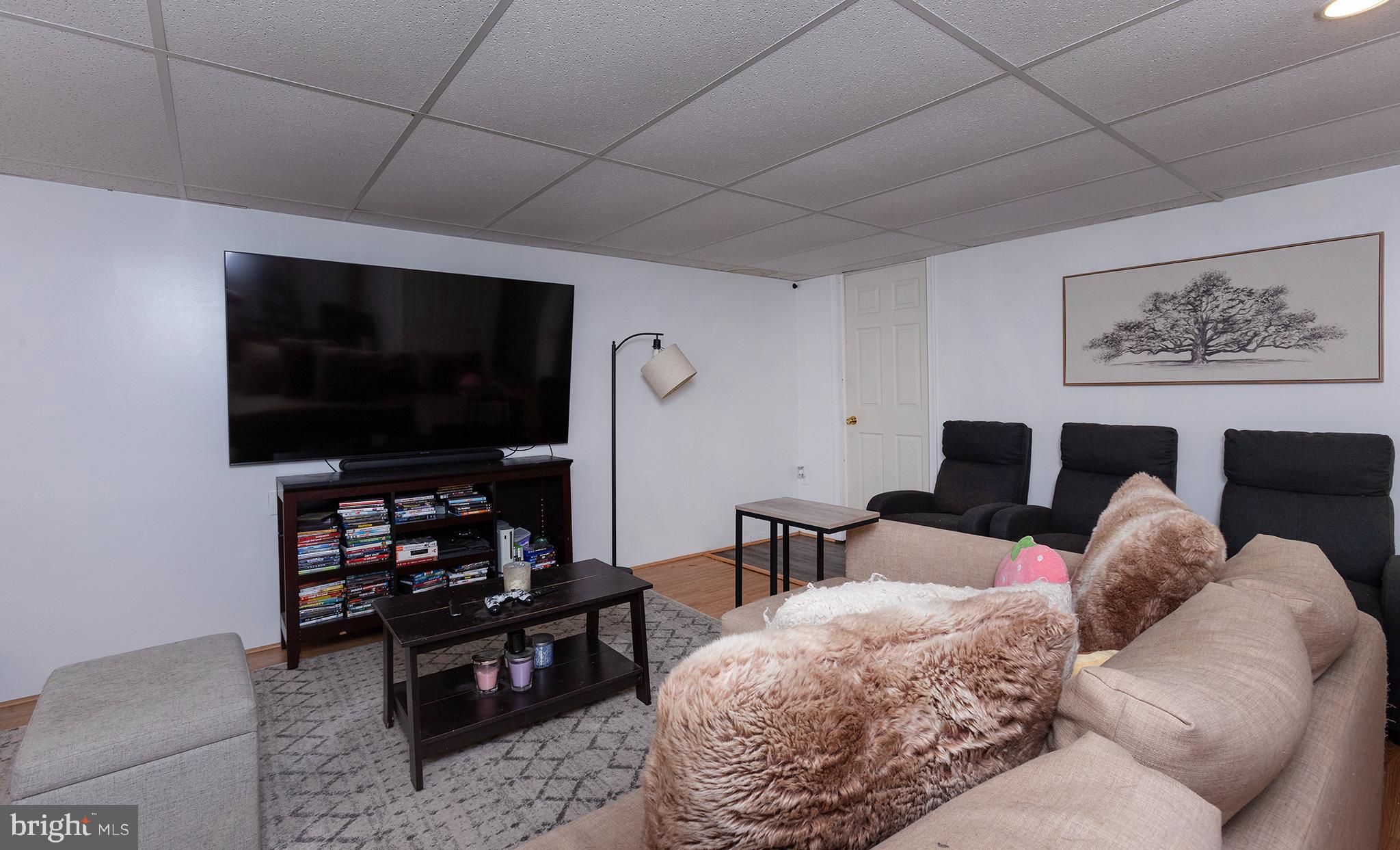 606 Butterfly Circle Dallastown, PA 17313 - Photo 26 of 40 a living room with furniture and a flat screen tv