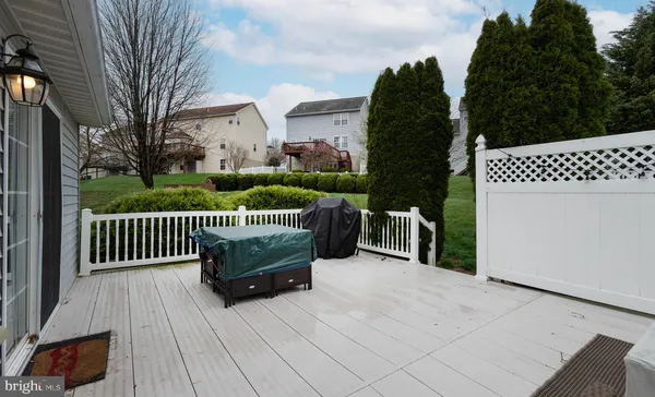 a view of a patio in the backyard