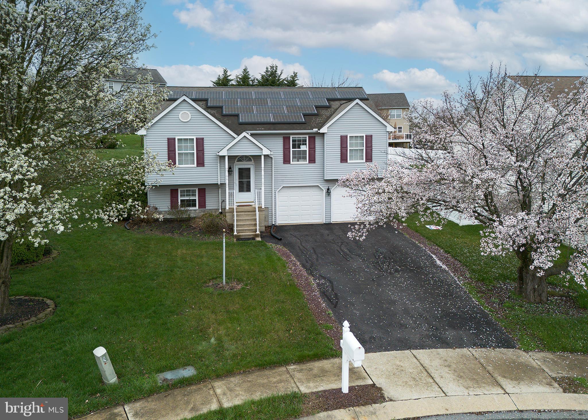 606 Butterfly Circle Dallastown, PA 17313 - Photo 31 of 40 a front view of a house with a yard