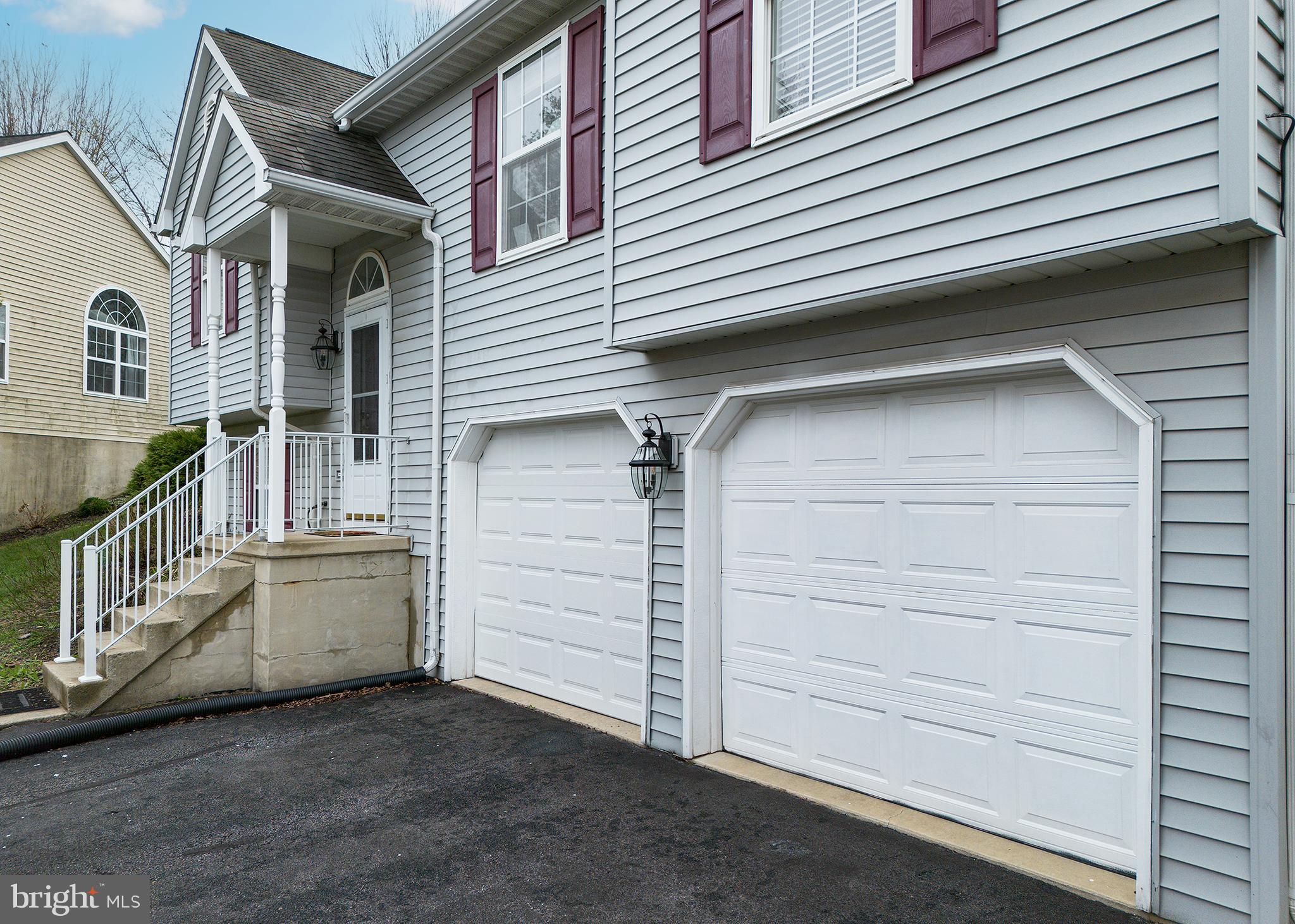 606 Butterfly Circle Dallastown, PA 17313 - Photo 35 of 40 a view of a house with a garage