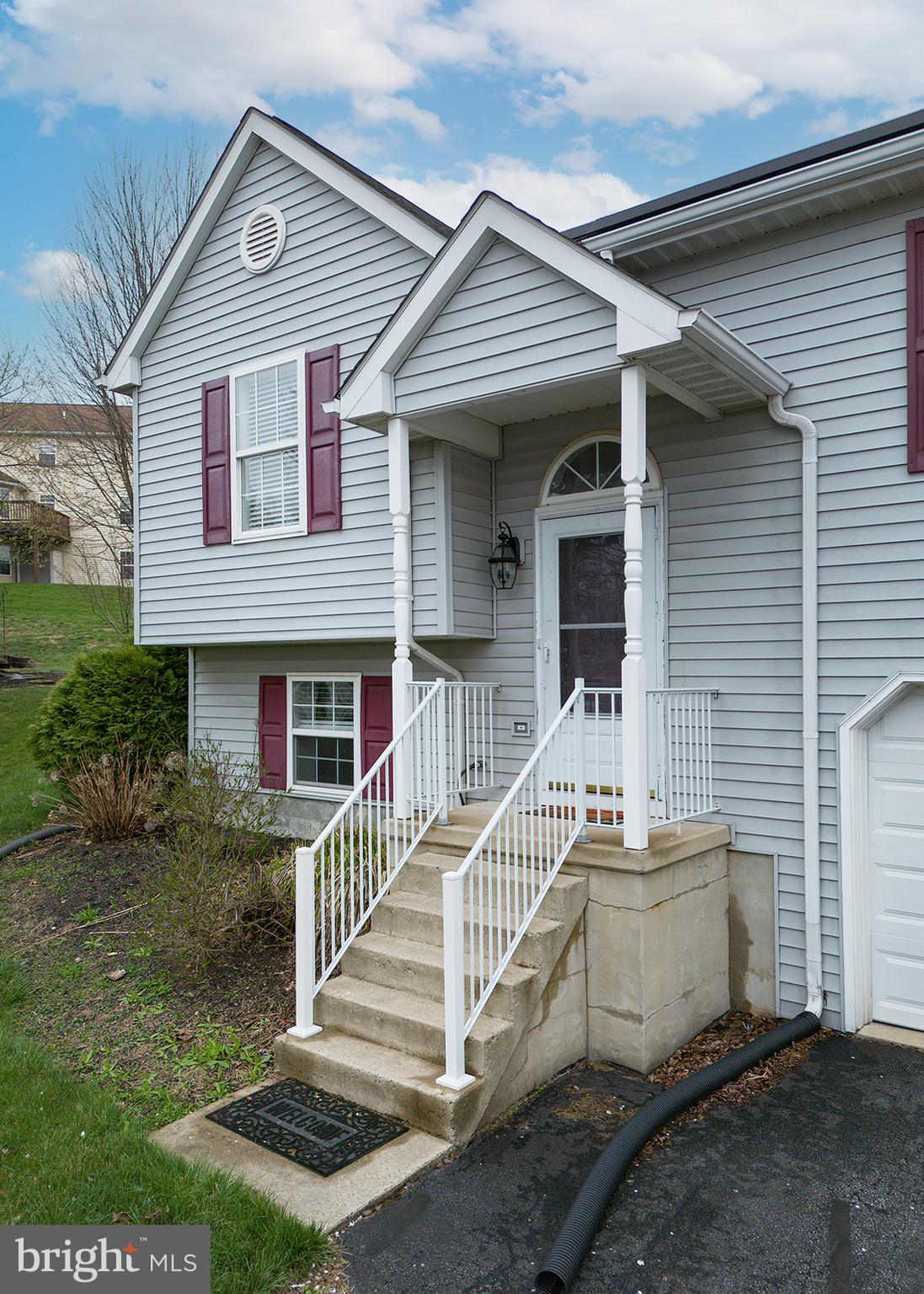 606 Butterfly Circle Dallastown, PA 17313 - Photo 36 of 40 a front view of a house with a yard