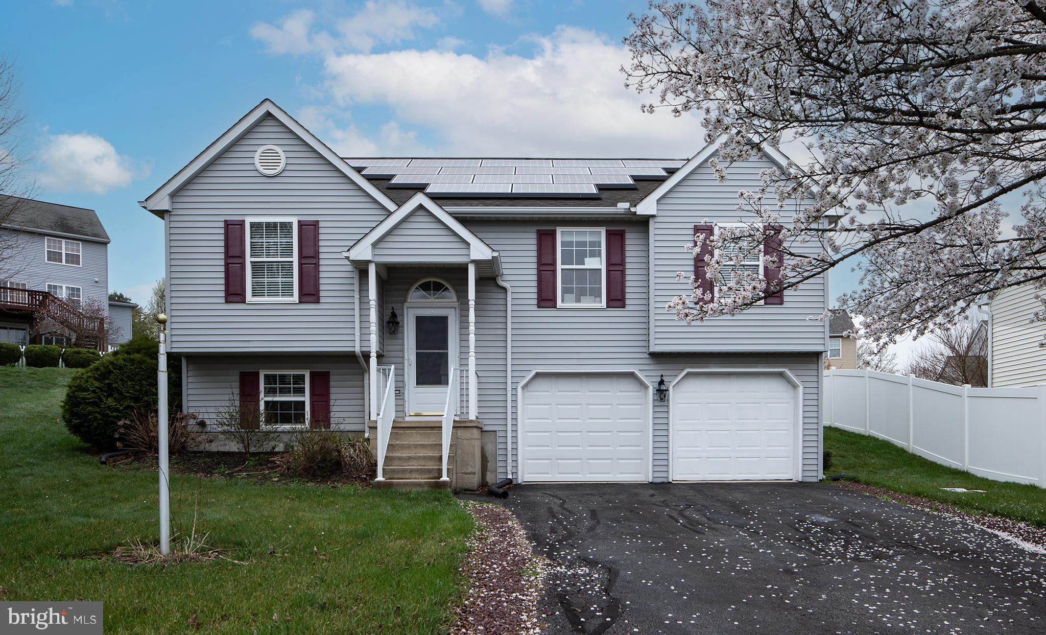 606 Butterfly Circle Dallastown, PA 17313 - Photo 38 of 40 a front view of a house with a yard and garage