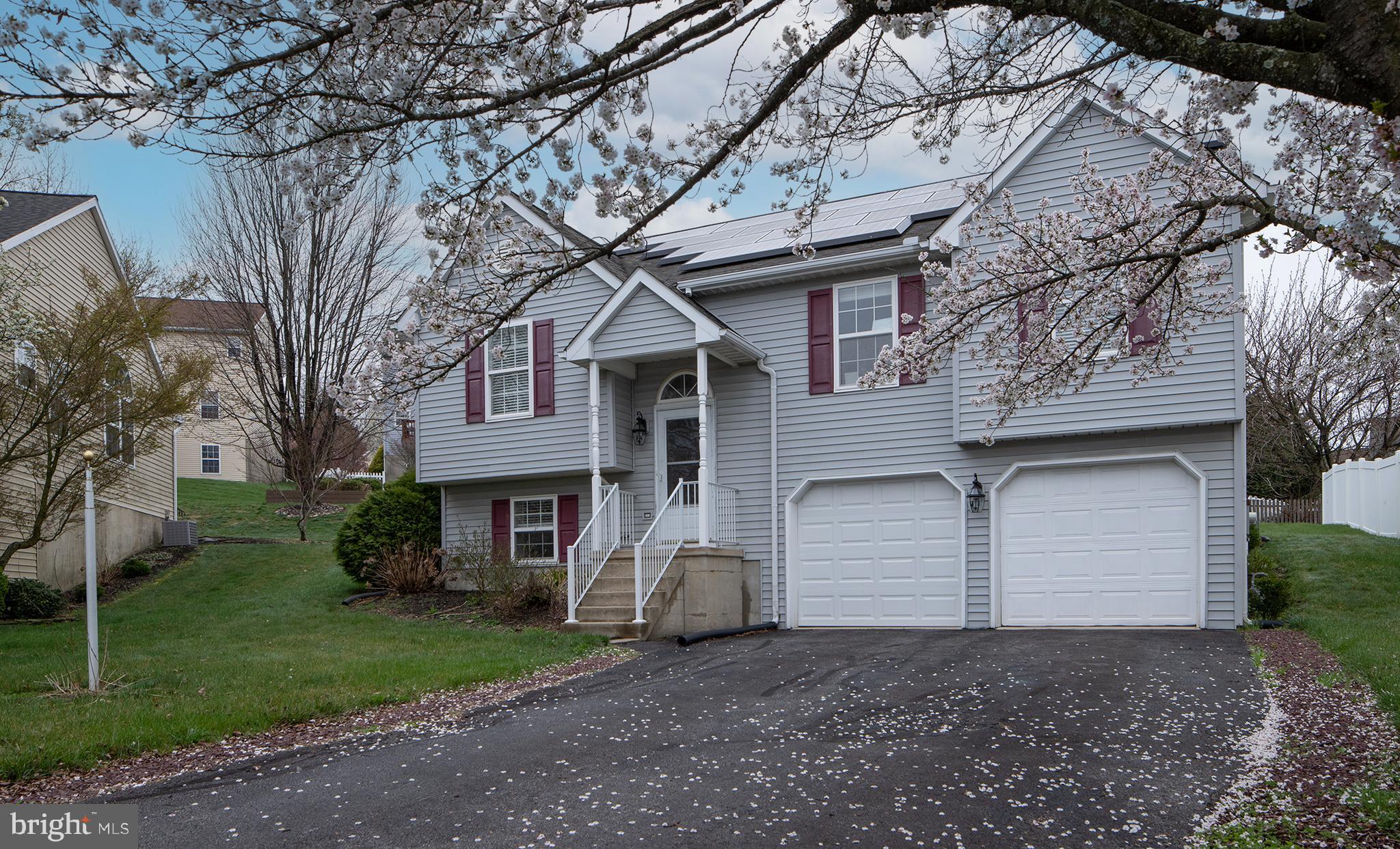 606 Butterfly Circle Dallastown, PA 17313 - Photo 39 of 40 a front view of a house with a yard and garage