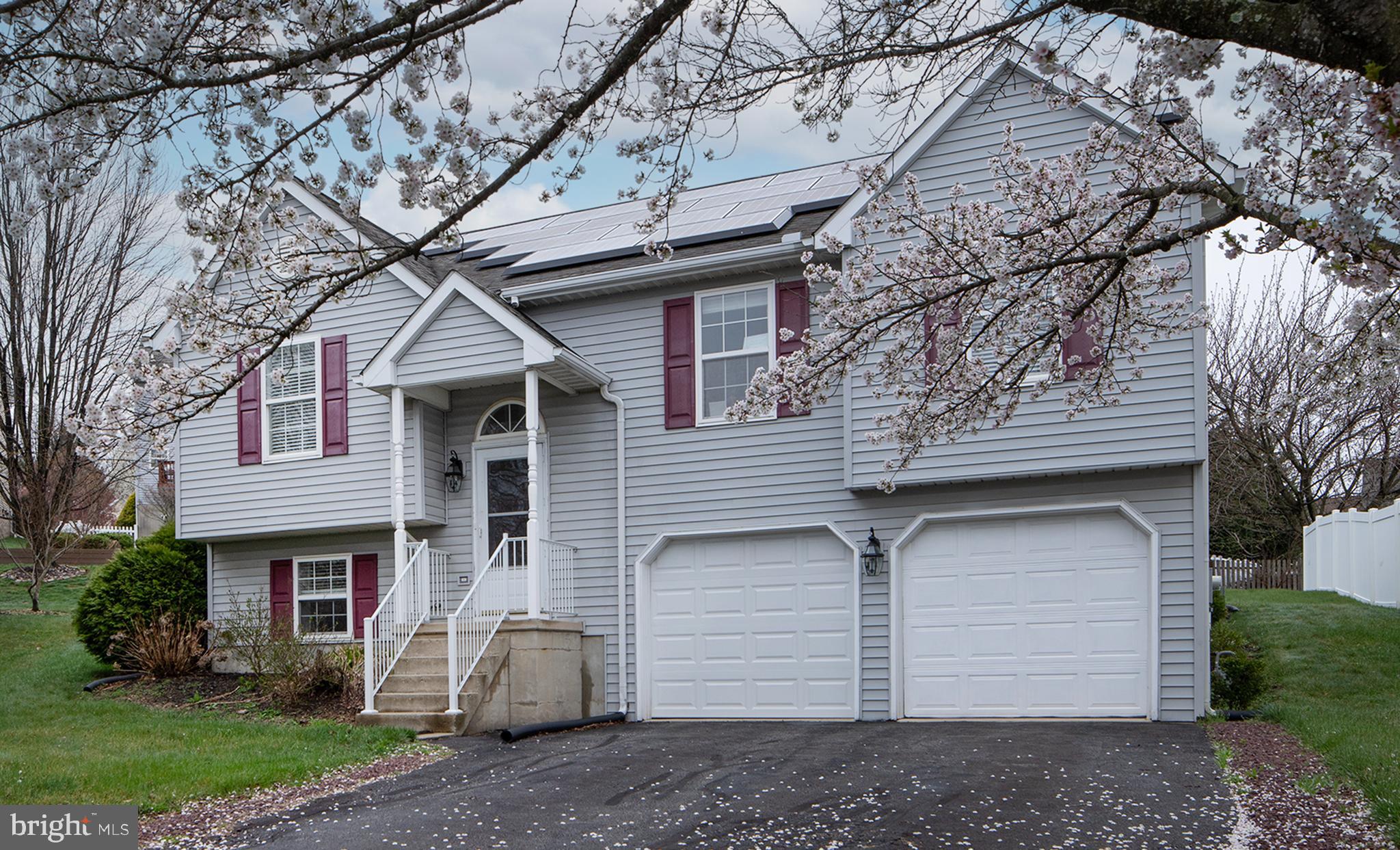 606 Butterfly Circle Dallastown, PA 17313 - Photo 40 of 40 a front view of a house with a yard and garage