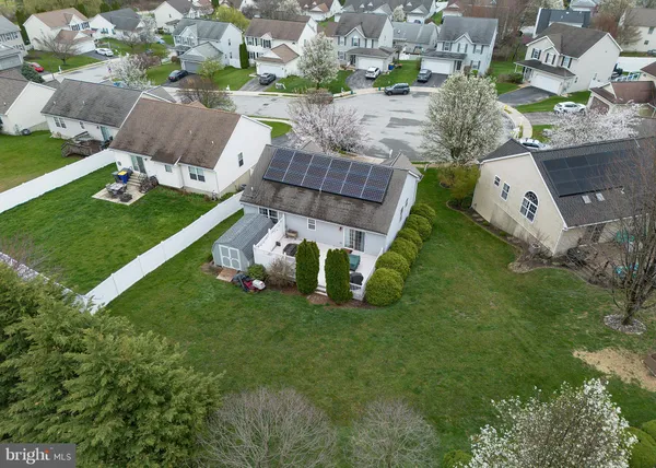 an aerial view of a house with a garden