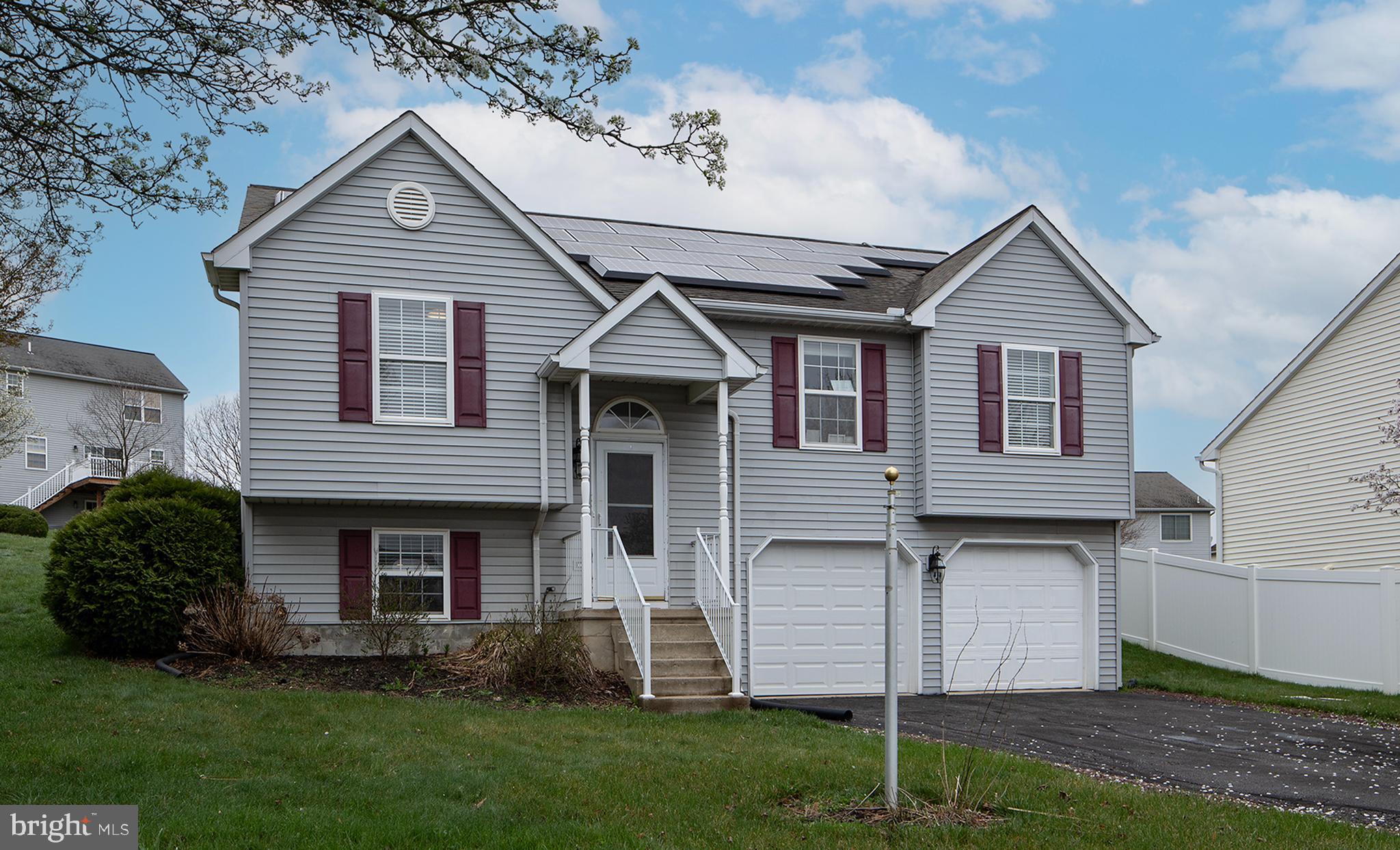 606 Butterfly Circle Dallastown, PA 17313 - Photo 5 of 40 a front view of a house with a yard and garage