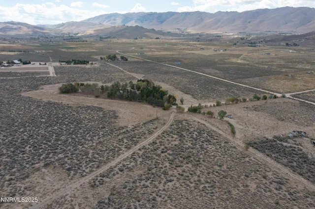 a view of an ocean beach and mountain