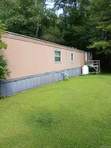 a view of a backyard with a small cabin