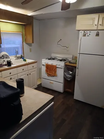 a kitchen with a stove and a refrigerator