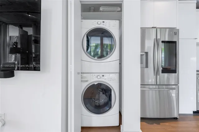 a view of a hallway with washer and dryer