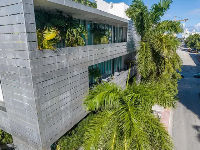 a view of a house with a tree