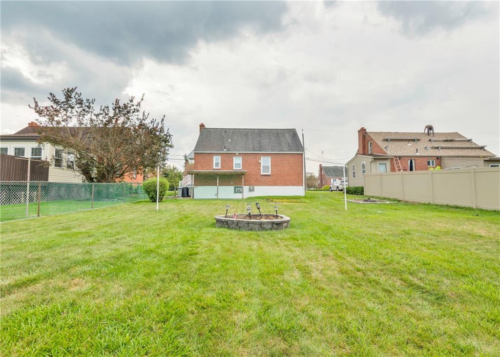 115 Rockwood Street Monroeville, PA 15146 - Photo 11 of 32 a view of a big house with a big yard and large trees