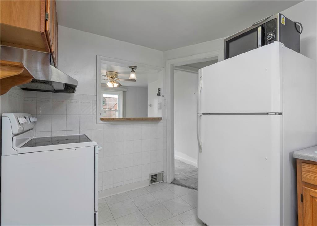 115 Rockwood Street Monroeville, PA 15146 - Photo 22 of 32 a utility room with cabinets washer and dryer
