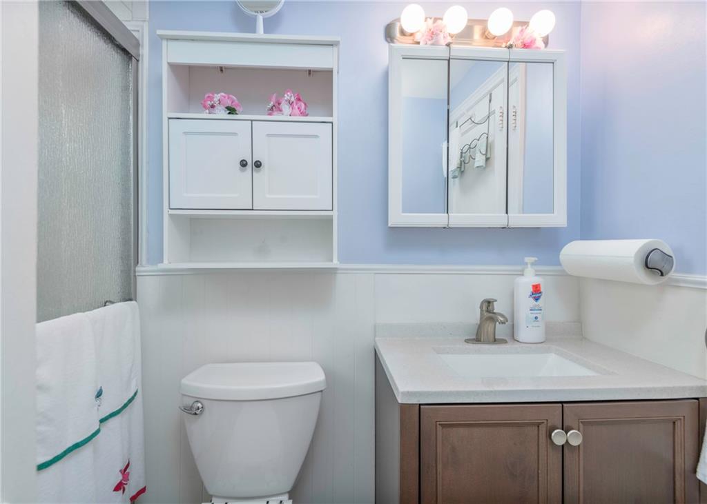 115 Rockwood Street Monroeville, PA 15146 - Photo 24 of 32 a bathroom with a toilet sink and mirror