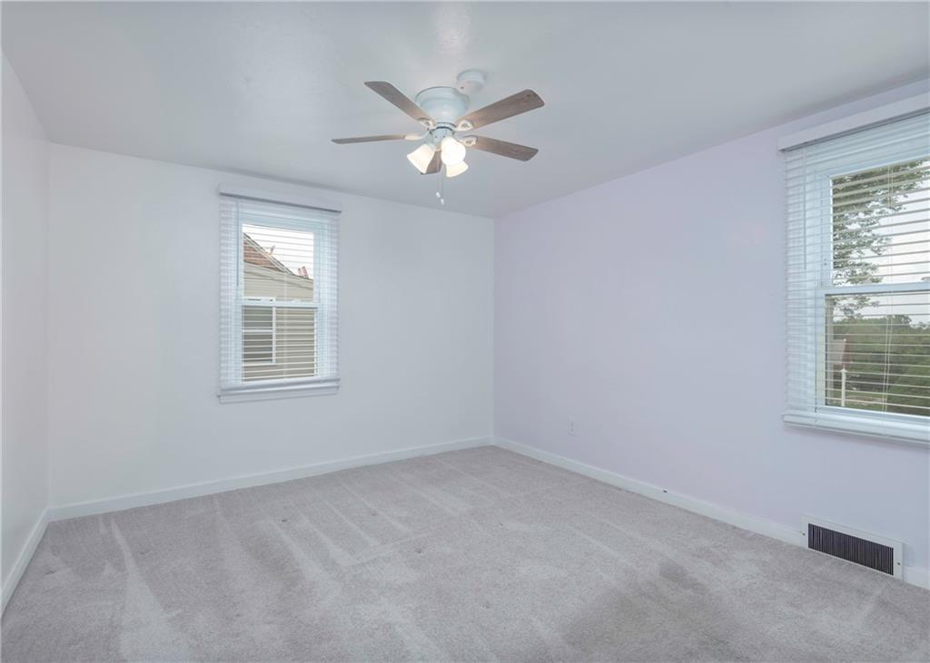 115 Rockwood Street Monroeville, PA 15146 - Photo 25 of 32 an empty room with windows and fan