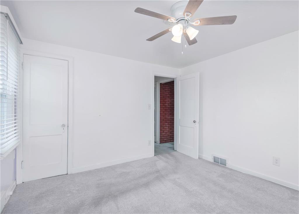 115 Rockwood Street Monroeville, PA 15146 - Photo 26 of 32 an empty room with closet and a chandelier fan