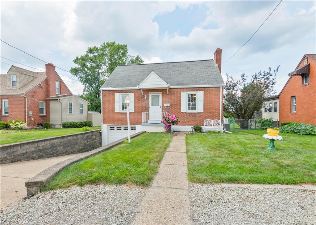 115 Rockwood Street Monroeville, PA 15146 - Photo 4 of 32 a front view of a house with a yard and trees