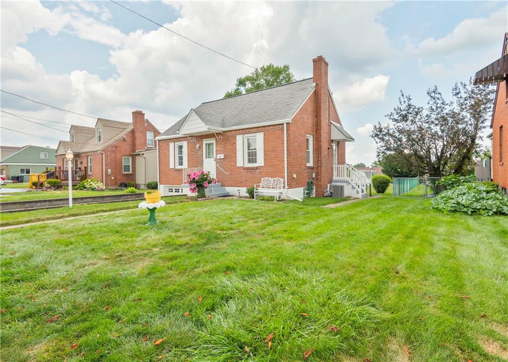 115 Rockwood Street Monroeville, PA 15146 - Photo 6 of 32 a view of a house with a big yard and large trees