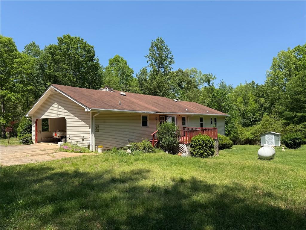 7260 Cox Road Cumming, GA 30028 - Photo 15 of 18 a front view of a house with garden