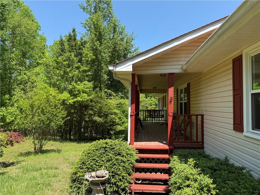 7260 Cox Road Cumming, GA 30028 - Photo 3 of 18 a backyard of a house with lots of green space