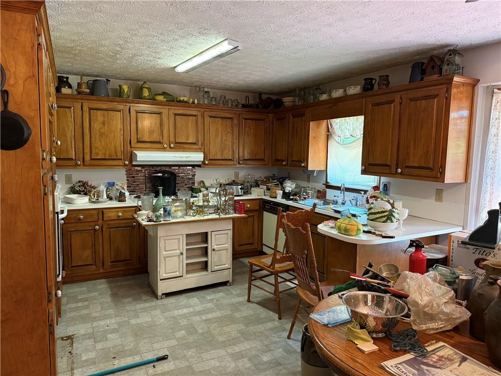 7260 Cox Road Cumming, GA 30028 - Photo 6 of 18 a kitchen with a sink appliances cabinets and furniture
