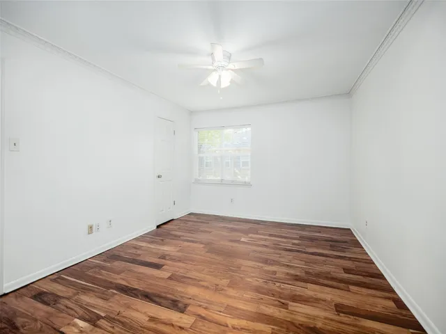 wooden floor in a room with a window