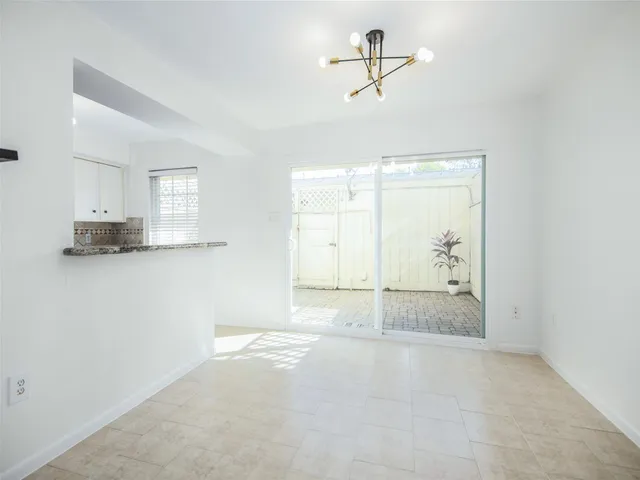 a view of a kitchen with a sink and cabinet area