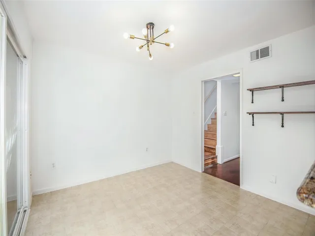a view of a room with cabinet and a ceiling fan