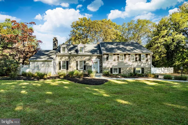a front view of a building with a garden