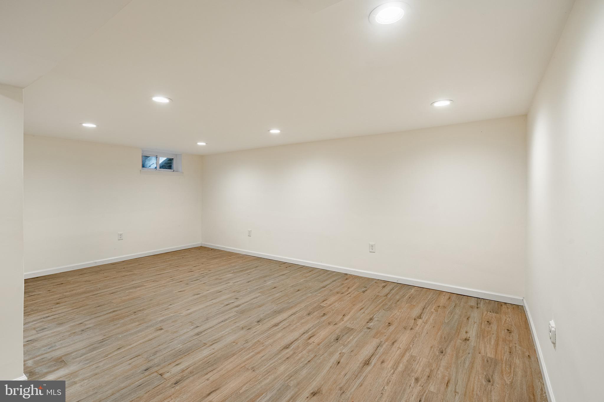 657 Walker Road Wayne, PA 19087 - Photo 15 of 66 an empty room with wooden floor and windows