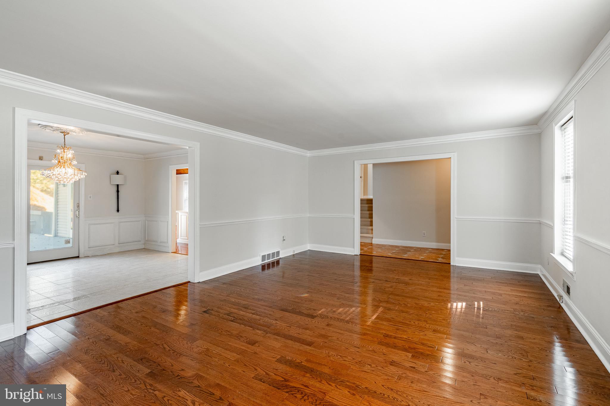 657 Walker Road Wayne, PA 19087 - Photo 20 of 66 a view of an empty room with wooden floor and a window