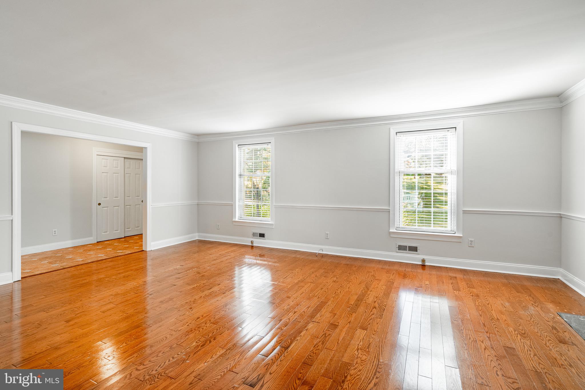 657 Walker Road Wayne, PA 19087 - Photo 21 of 66 an empty room with wooden floor and windows