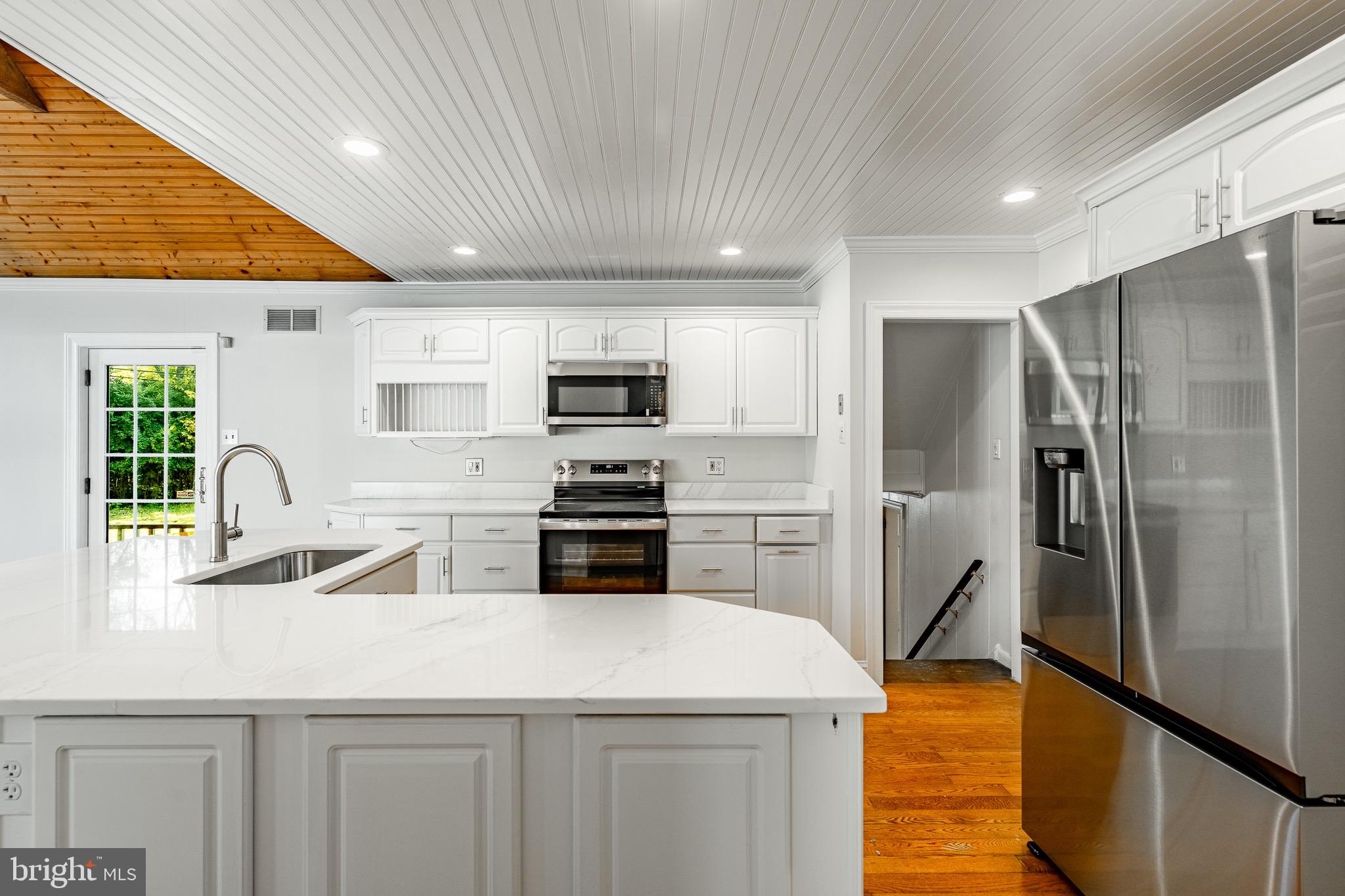 657 Walker Road Wayne, PA 19087 - Photo 24 of 66 a kitchen with stainless steel appliances a refrigerator sink and microwave