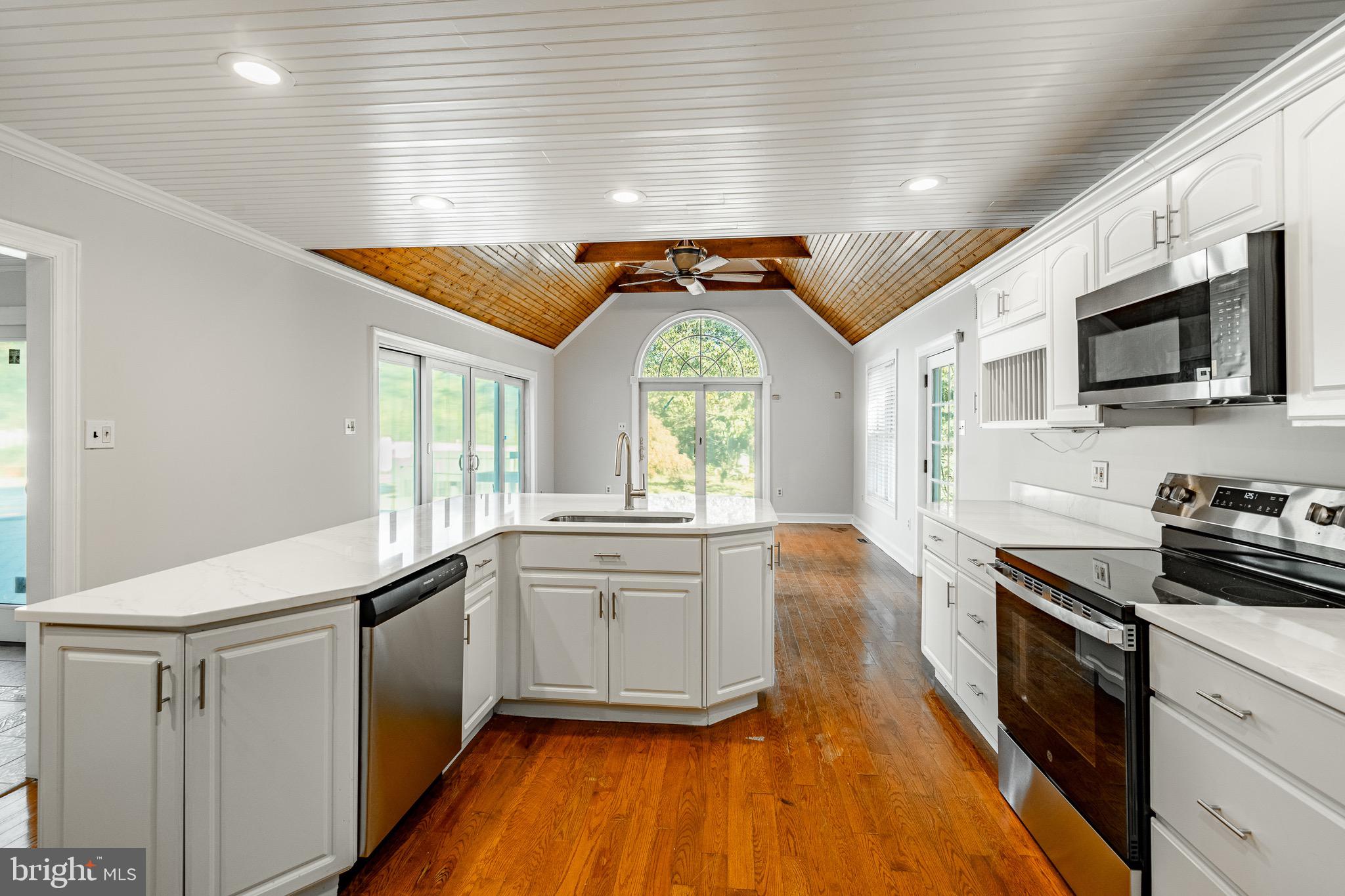 657 Walker Road Wayne, PA 19087 - Photo 25 of 66 a kitchen with stainless steel appliances granite countertop a stove a sink and a refrigerator