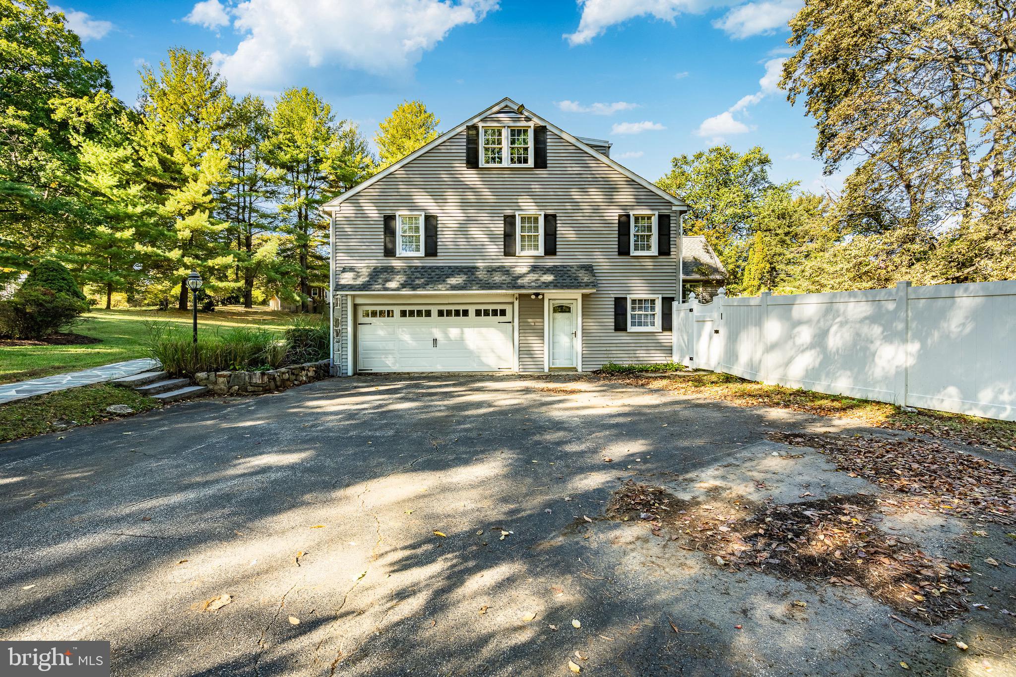 657 Walker Road Wayne, PA 19087 - Photo 4 of 66 a front view of a house with a yard
