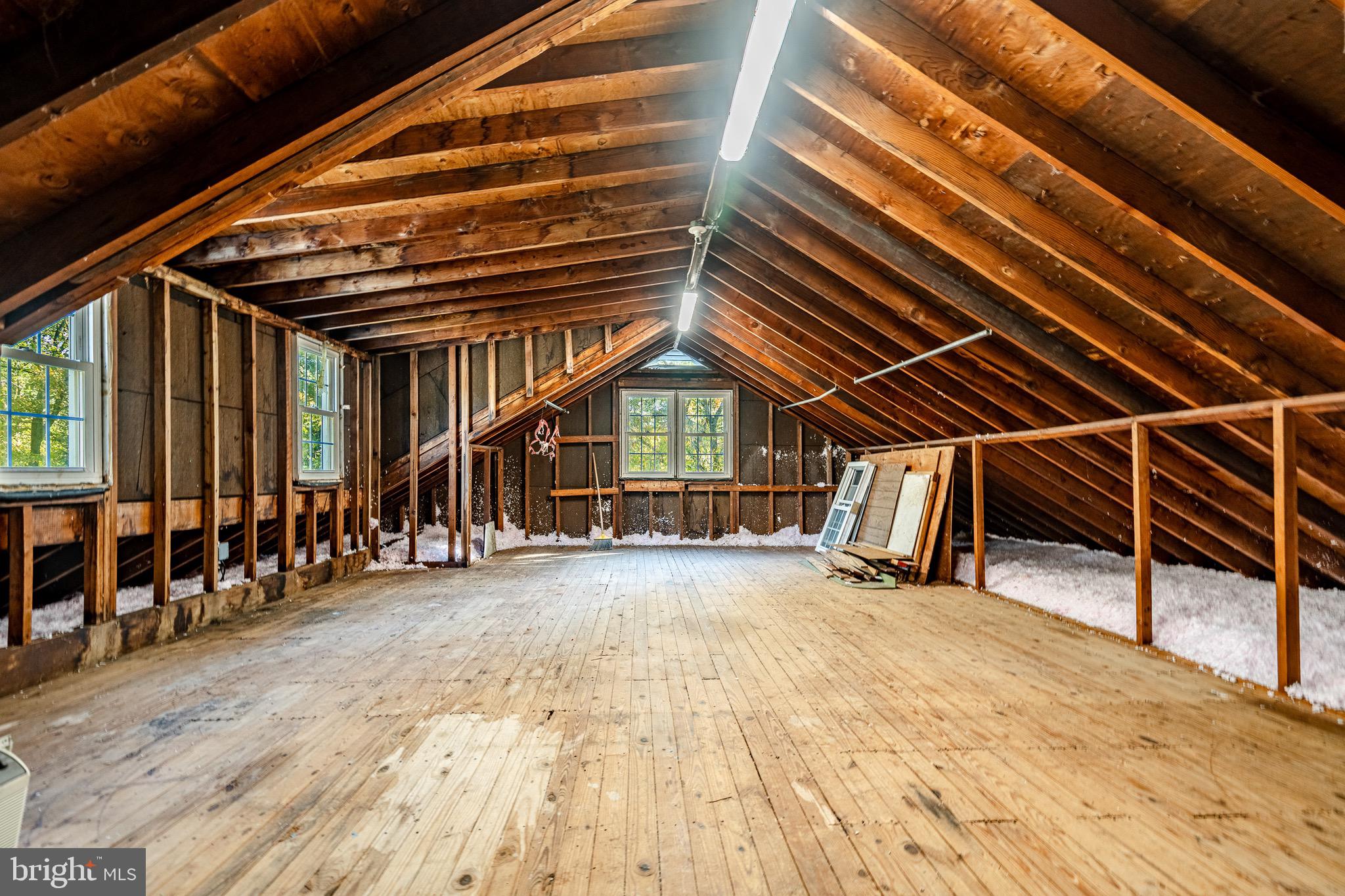 657 Walker Road Wayne, PA 19087 - Photo 47 of 66 a view of an empty room with wooden floor and windows