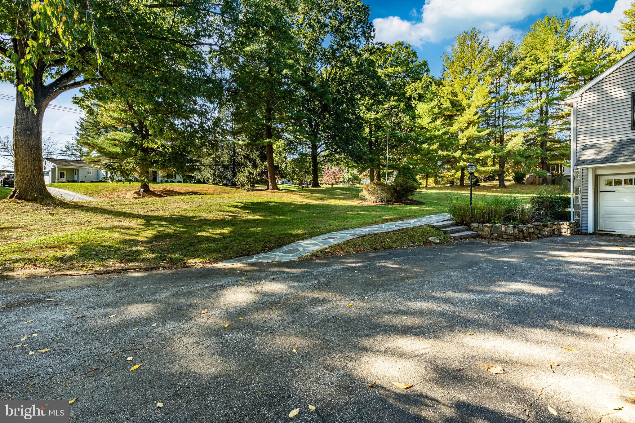 657 Walker Road Wayne, PA 19087 - Photo 5 of 66 a view of a yard with a large tree