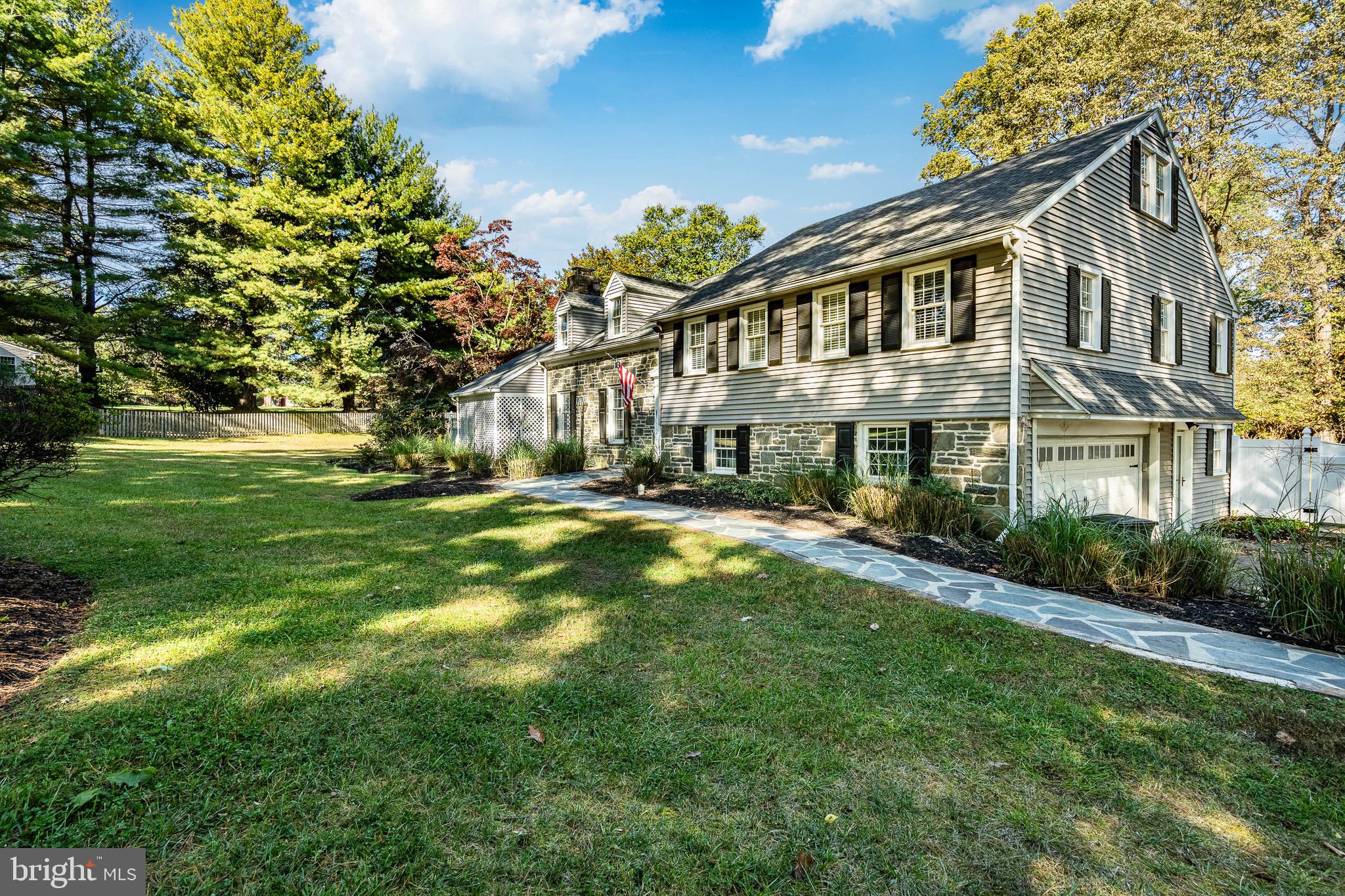 657 Walker Road Wayne, PA 19087 - Photo 6 of 66 a front view of a house with a yard