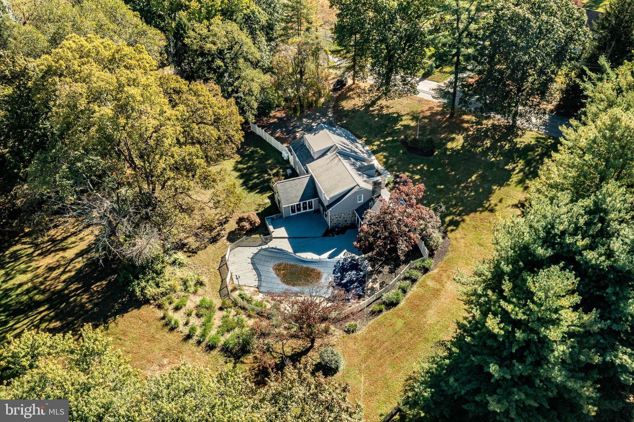 657 Walker Road Wayne, PA 19087 - Photo 62 of 66 a view of a house with a yard and large trees